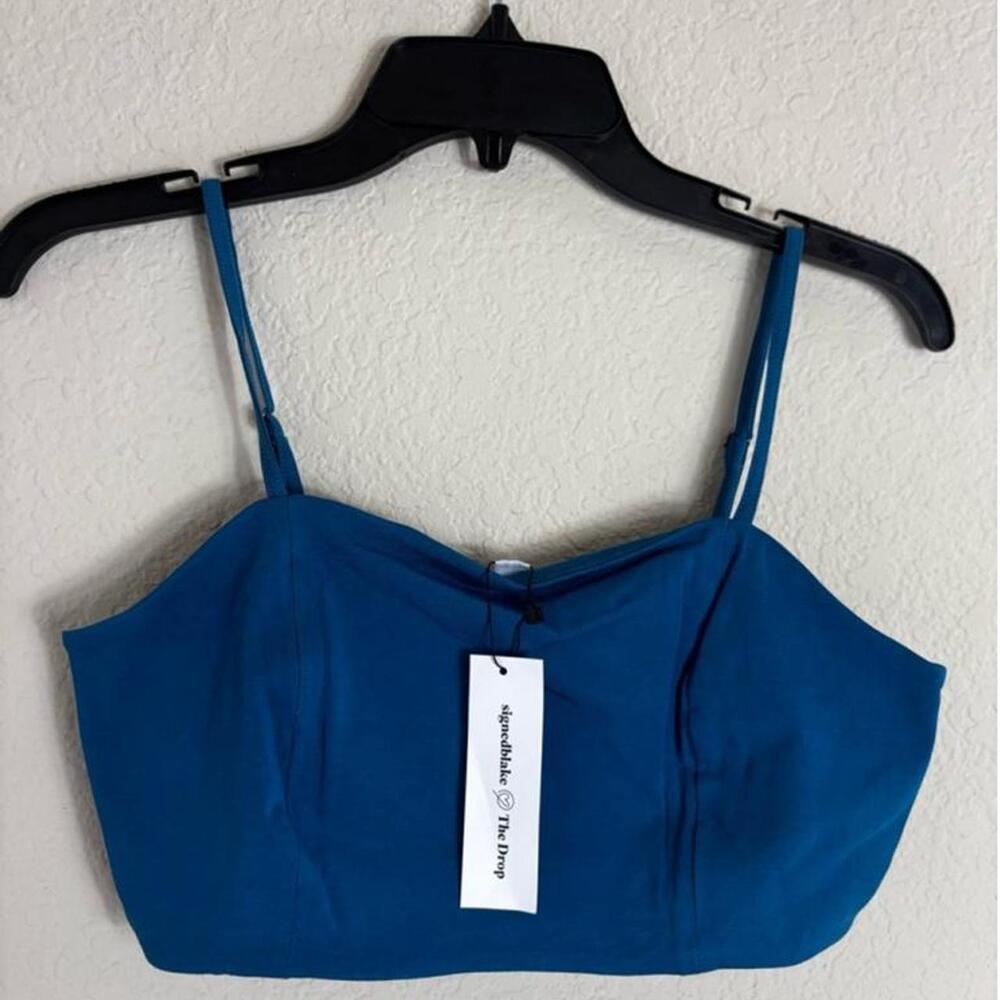 This is a new with tags "The Drop" Blue Sapphire Bralette Top, size L